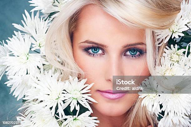 Young Womans Face Surrounded By White Flowers Stock Photo - Download Image Now - 20-29 Years, Adult, Adults Only