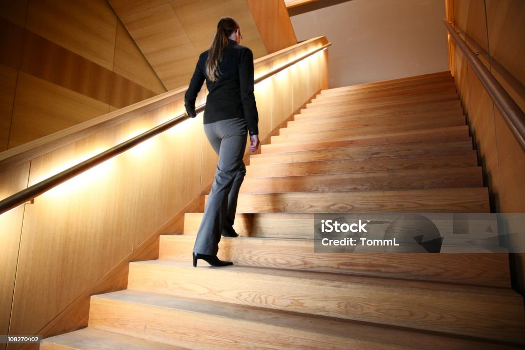 woman on staircase  Stepping Stock Photo