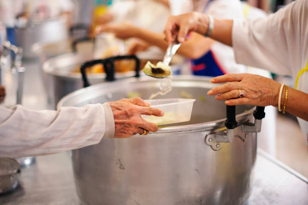 istock Concept of Feeding : Helping People With Hunger With Kindness 1082704172
