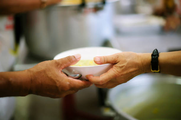 Concept of Feeding : Helping People With Hunger With Kindness