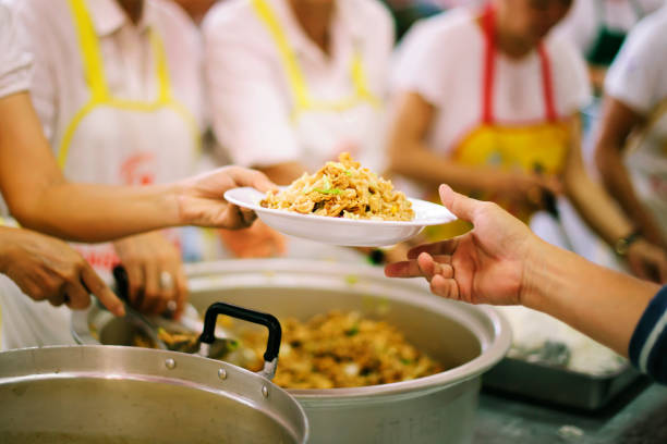 istock Concept of Feeding : Helping People With Hunger With Kindness 1082704206