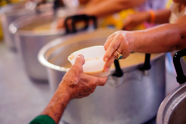 istock Concept of Feeding : Helping People With Hunger With Kindness 1082704226