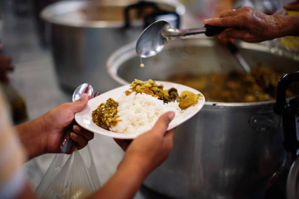 istock Concept of Feeding : Helping People With Hunger With Kindness 1082704368