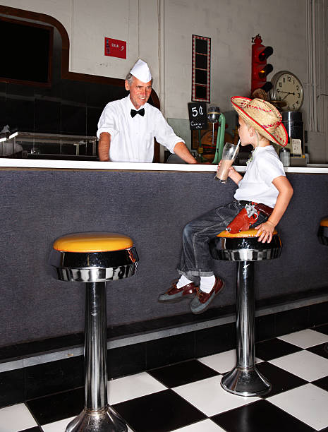 Boy Drinking Milkshake  bar stool photos stock pictures, royalty-free photos & images