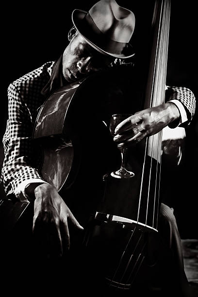 blues and jazz player  bass guitar stock pictures, royalty-free photos & images