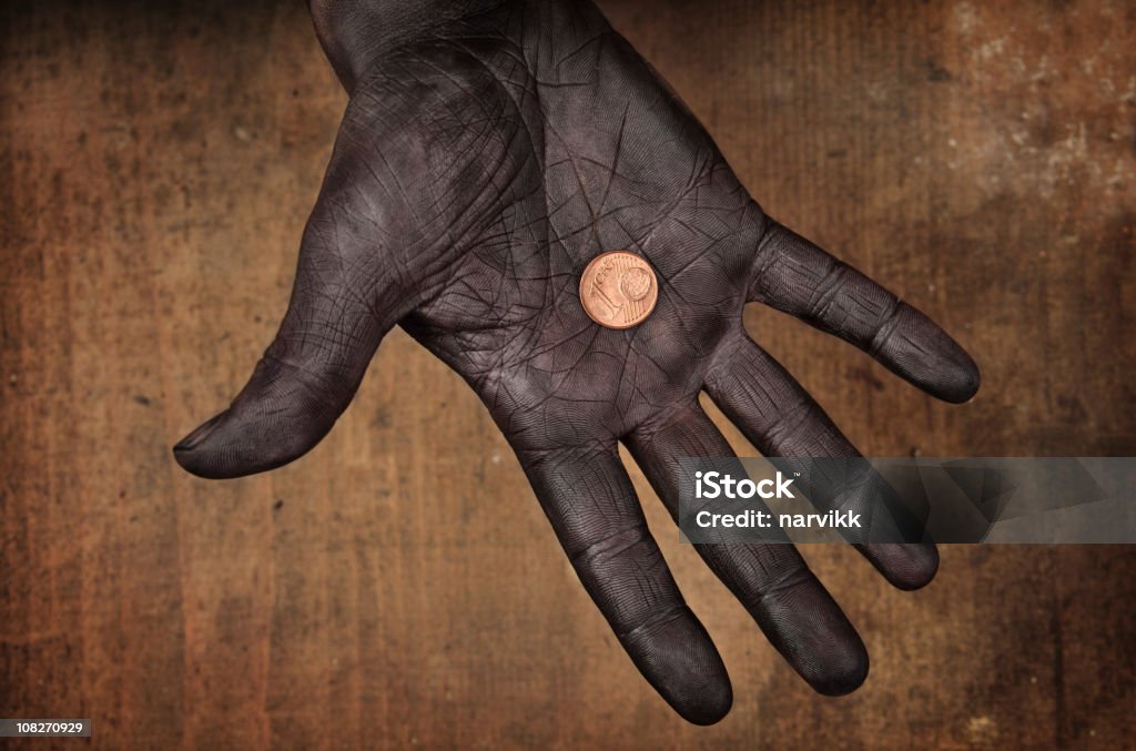 1 ユーロセント硬貨で人�間の手 - アフリカのロイヤリティフリーストックフォト