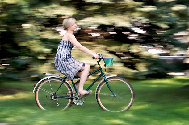 istock Pretty Girl Riding Vintage Bicycle - Motion Blur 108270933