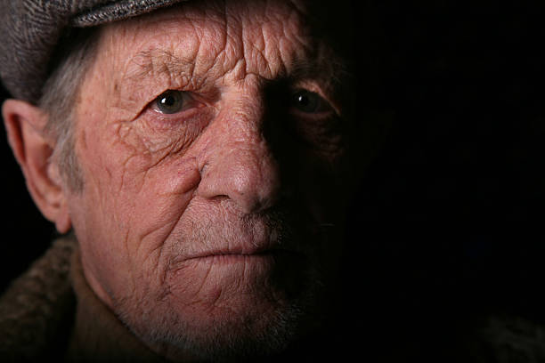 istock Elderly Man Stare with Dark Shadow 108271203