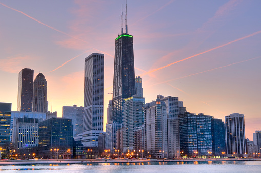 The north end of the Chicago lakefront skyline at sunset, taken from across Lake Michigan.  Featuring the Streeterville and Gold Coast neighborhoods.\n\nFor more Chicago images, see:\n[url=\