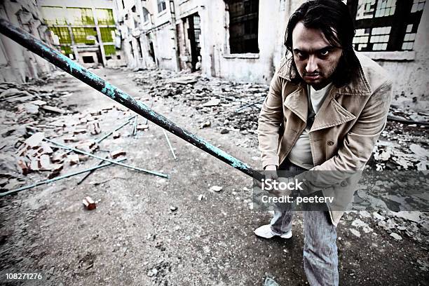 Man In Alley Holding Metal Pipe Stock Photo - Download Image Now - Aiming, Alley, Anger
