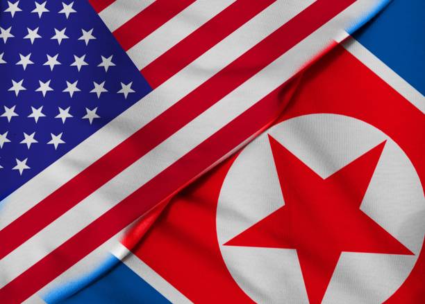 istock Two Flags. US flag. Flag of North Korea 1082712972