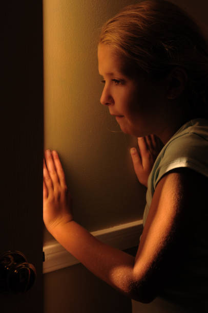 istock Girl peeking through open door 108271422