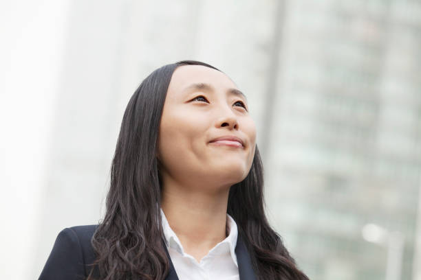 istock Chinese businesswoman looking up 1082717668