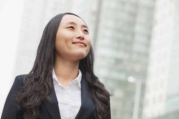 istock Chinese businesswoman looking up 1082717700