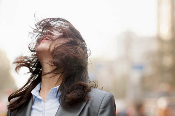 istock Wind blowing Chinese businesswoman's hair 1082718022