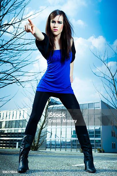 Urban Young Woman Pointing Stock Photo - Download Image Now - Adult, Adults Only, Architecture