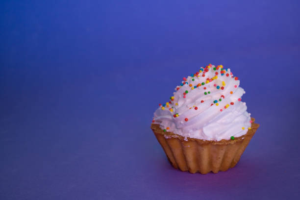 istock dessert with cream in a basket stands on a lilac background 1082720118