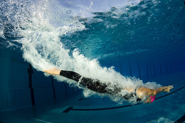 istock Female swimmer diving, underwater shot 108272074