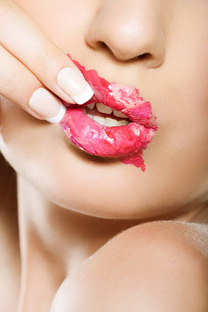 istock woman touching pink lips 108272194