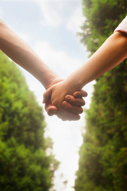 istock Chinese couple holding hands in park 1082722062