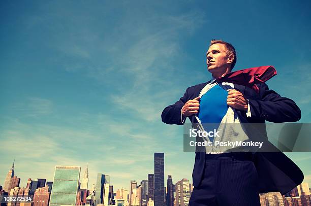 Superhero Young Man Businessman Standing Outdoors Over City Skyline Stock Photo - Download Image Now