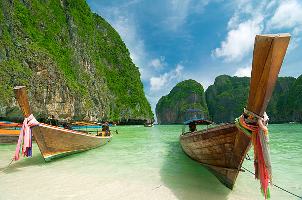 istock Long tail boats on the beach on an island 108272692