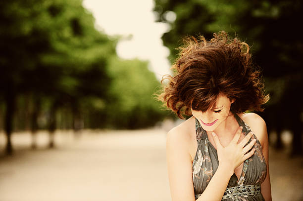 Portrait of a photographer covering her face with the camera. Travel Tourism Camera Photography Concept Wanderlust.