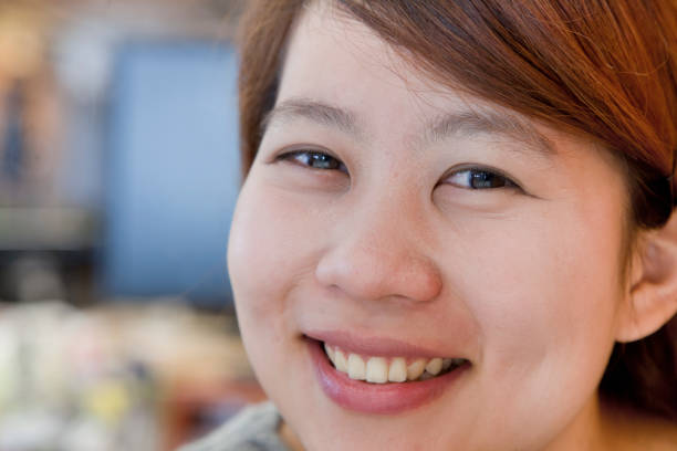 istock Chinese woman smiling in office 1082730914