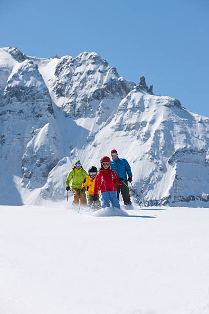 istock Family skiing together 108273210