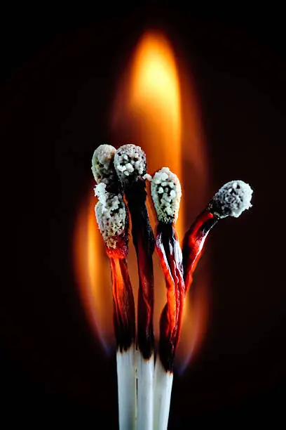 Photo of cluster of burning matches