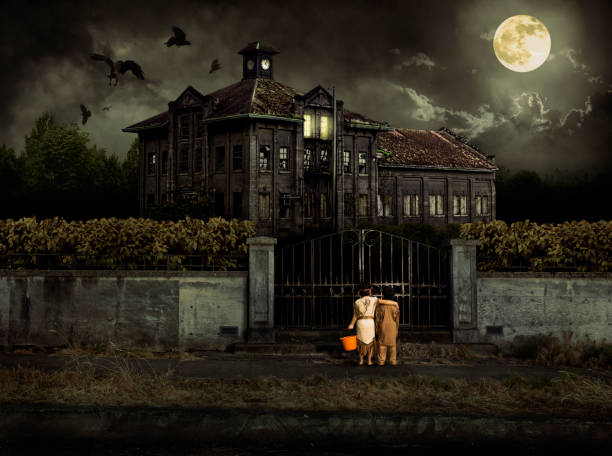 costumed kids trick or treat at halloween haunted house - haunted house stok fotoğraflar ve resimler