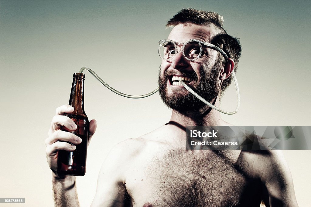Young Man Drinking Beer Out Of Crazy Straw Glasses Stock Photo - Download  Image Now - Bizarre, Beer - Alcohol, Drinking Straw - iStock