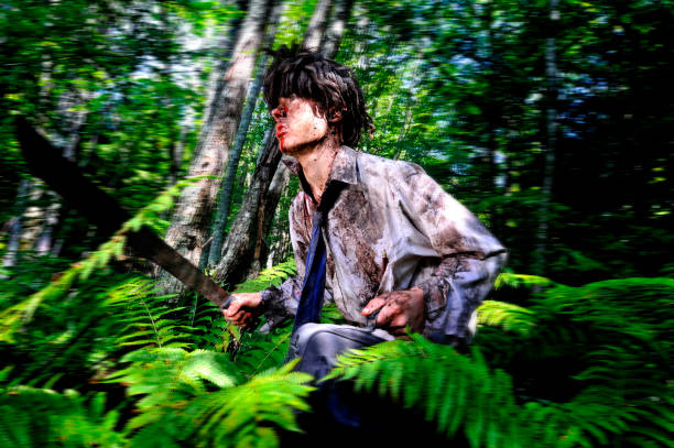 It's a Jungle Out There This photo series might be used for young business and school concepts. Teen is lost in a realistic and/or metaphoric jungle and is adapting to survive. In this photo our tie-wearing protagonist races through the jungle from right to left while holding a machete and lap top case. Machete stock pictures, royalty-free photos & images