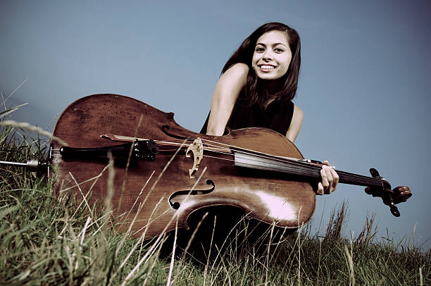 istock Young woman outdoor with cello 108273886