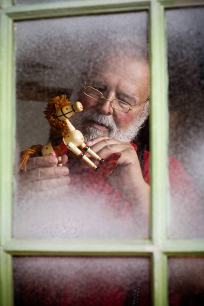 Busy Santa Claus Making Christmas Toys in Workshop, Copyspace