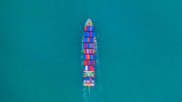 istock Container ship carrying container for import and export, business logistic and transportation by container ship in open sea. 1082739190