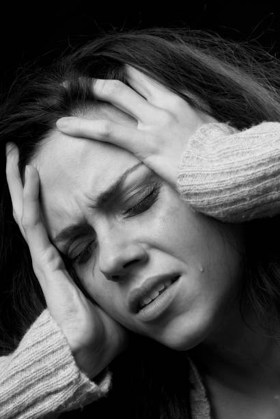 istock Migrane: woman's face with tears and smeared makeup 108273936