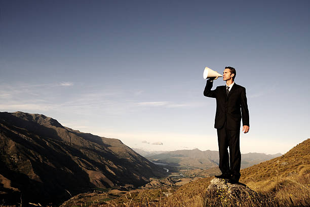 istock Businessman with Megaphone in Valley 108274158