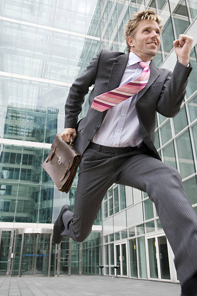 istock Young Businessman Running From Office Building 108274161
