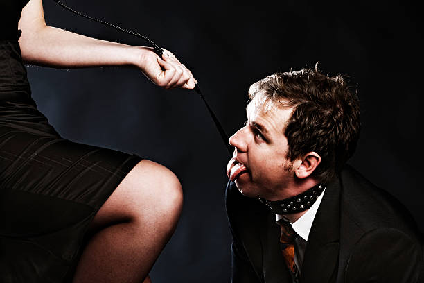 Panting businessman on a leash Tied Up Bondage Women Fetish Wear stock pictures, royalty-free photos & images