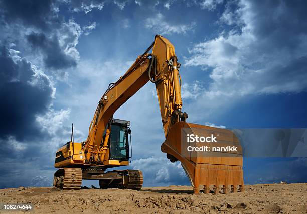 Yellow Excavator At Construction Site Stock Photo - Download Image Now - Backhoe, Construction Machinery, Machinery