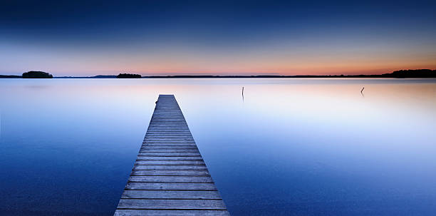 istock Calm Lake with Boardwalk Dock at Sunset 108274683