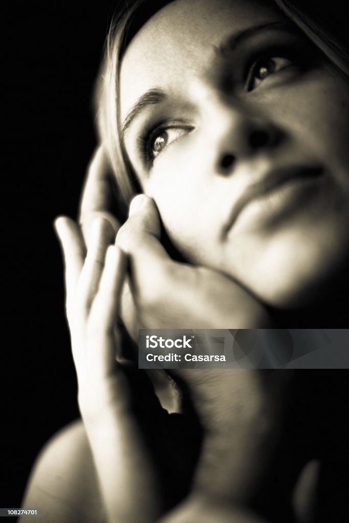 Portrait of Young Woman Holding Man's Hand Against Face  20-24 Years Stock Photo