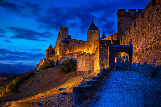Carcassonne,France - May 15, 2025: Stone pavements and hotels in Carcassonne, fortified city, in France at night