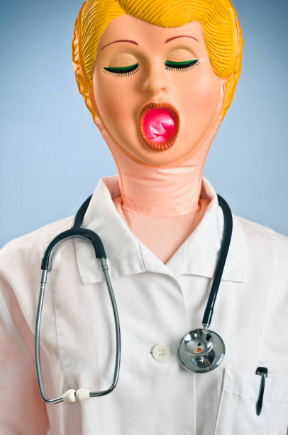 Plastic Doctor Bow up doll dressed as a doctor giving advice. blow up doll stock pictures, royalty-free photos & images