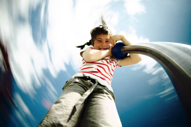 Happy girl in park. ( blur motion effect ) 