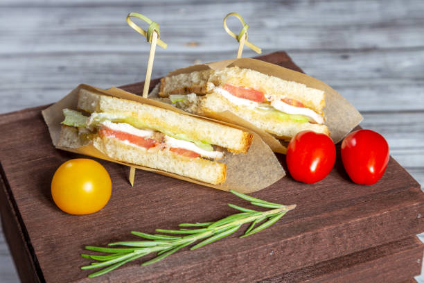istock Small sandwitches with turkey, tomatos and lettuce 1082760622
