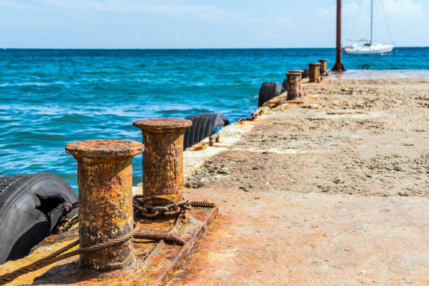 istock Rusted bollards on a concrete pier 1082762212