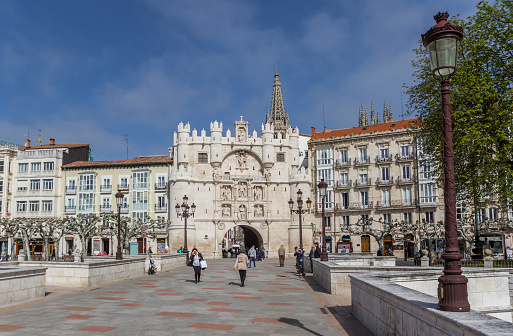 Burgos, Spain - April 24, 2018: Santa Maria bridge and historic city gate in Burgos, Spain