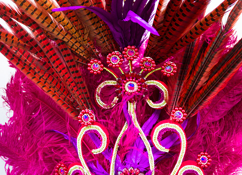 helmet decorated with bright stones and feathers for carnival